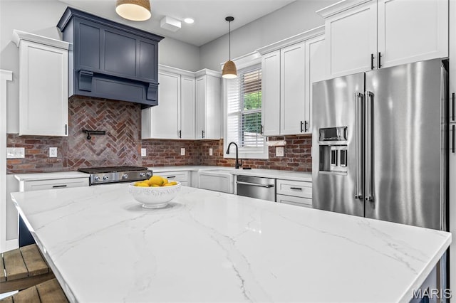 422 N 2nd St, De Soto, MO 63020 - kitchen featuring stainless steel appliances, custom exhaust hood, decorative backsplash, and light stone countertops