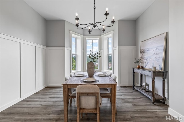 422 N 2nd St, De Soto, MO 63020 - dining space with a decorative wall, a chandelier, dark wood finished floors, and a wainscoted wall