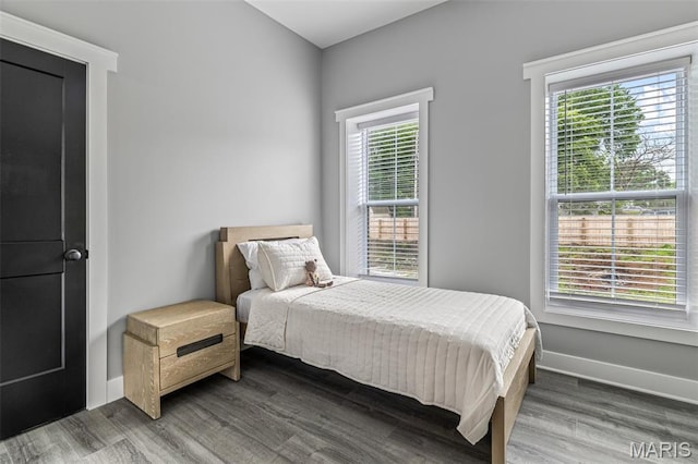 422 N 2nd St, De Soto, MO 63020 - bedroom featuring multiple windows and wood finished floors