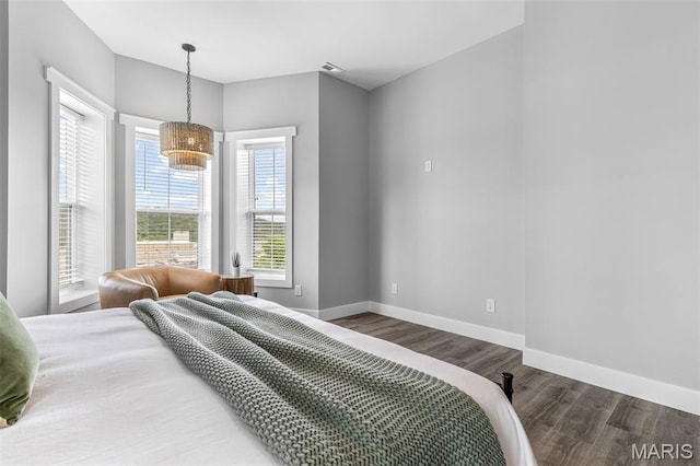 422 N 2nd St, De Soto, MO 63020 - bedroom with wood finished floors and a chandelier