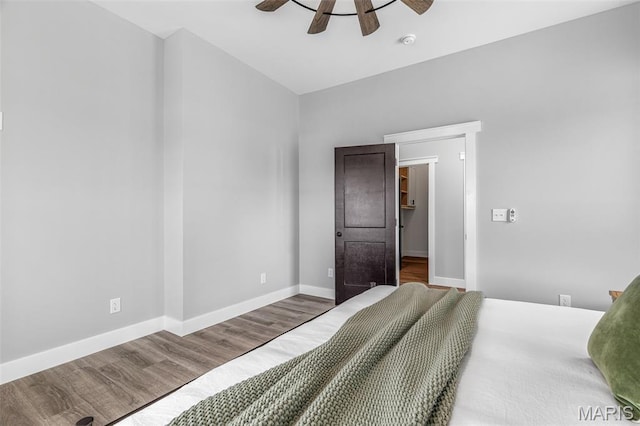 422 N 2nd St, De Soto, MO 63020 - bedroom with wood finished floors and ceiling fan