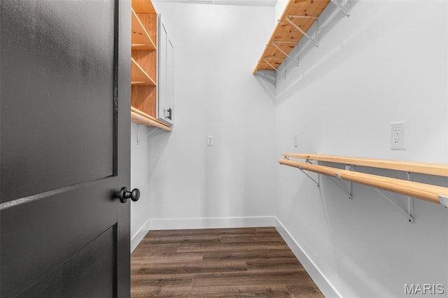 422 N 2nd St, De Soto, MO 63020 - spacious closet featuring dark wood finished floors