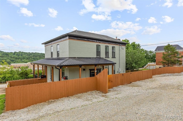 422 N 2nd St, De Soto, MO 63020 - view of front facade with a metal roof and a porch
