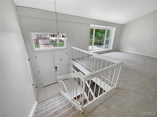 887 Totem Woods Ct, Manchester, MO 63021 - stairs featuring a chandelier and carpet