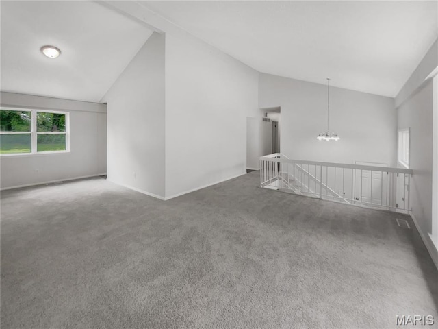 887 Totem Woods Ct, Manchester, MO 63021 - carpeted empty room featuring a chandelier and high vaulted ceiling