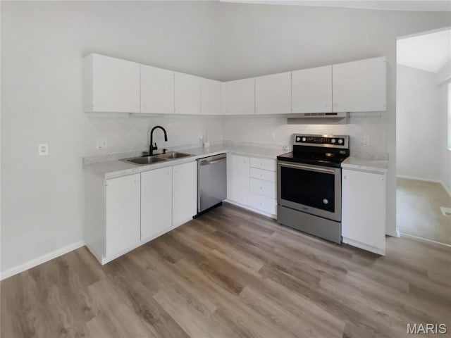 887 Totem Woods Ct, Manchester, MO 63021 - kitchen featuring appliances with stainless steel finishes, tasteful backsplash, and light countertops
