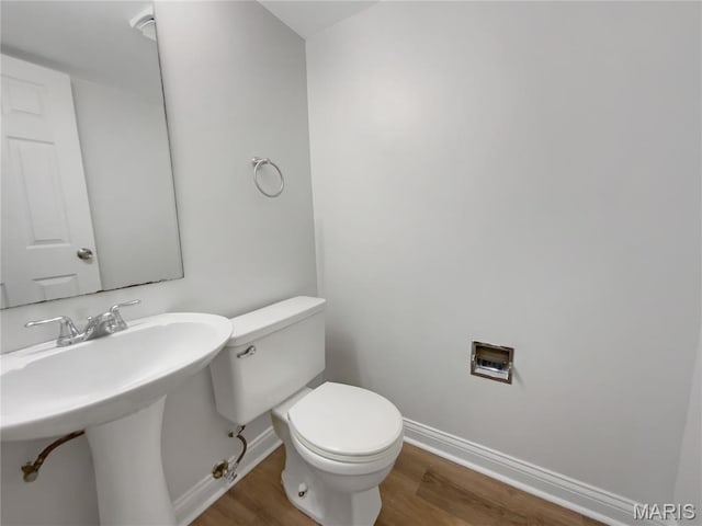 887 Totem Woods Ct, Manchester, MO 63021 - bathroom featuring baseboards and wood finished floors