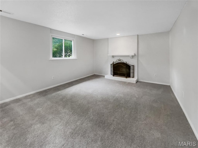 887 Totem Woods Ct, Manchester, MO 63021 - unfurnished living room featuring a fireplace, carpet flooring, and recessed lighting
