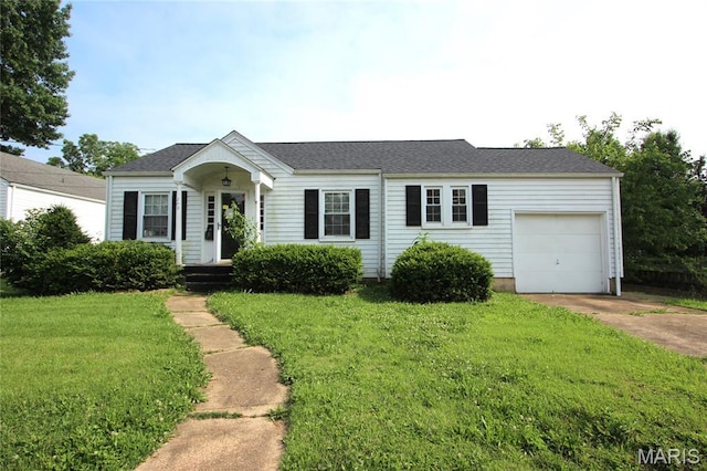 205 Deguire, Fredericktown, MO 63645 - view of front of house featuring concrete driveway, an attached garage, a front lawn, and roof with shingles