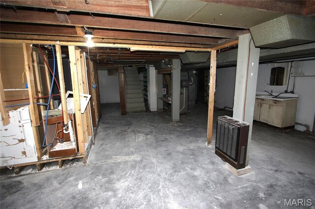 205 Deguire, Fredericktown, MO 63645 - unfinished below grade area featuring stairway and heating unit