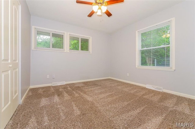 3702 E 106th Ter, Kansas City, MO 64137 - carpeted empty room with a ceiling fan and baseboards