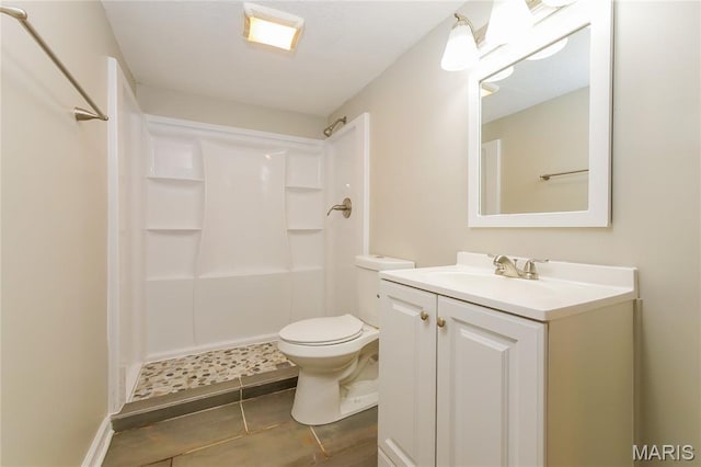 3702 E 106th Ter, Kansas City, MO 64137 - bathroom with vanity, a shower, and tile patterned floors