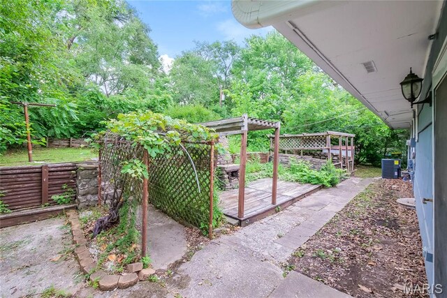 3702 E 106th Ter, Kansas City, MO 64137 - view of yard with a deck and a pergola