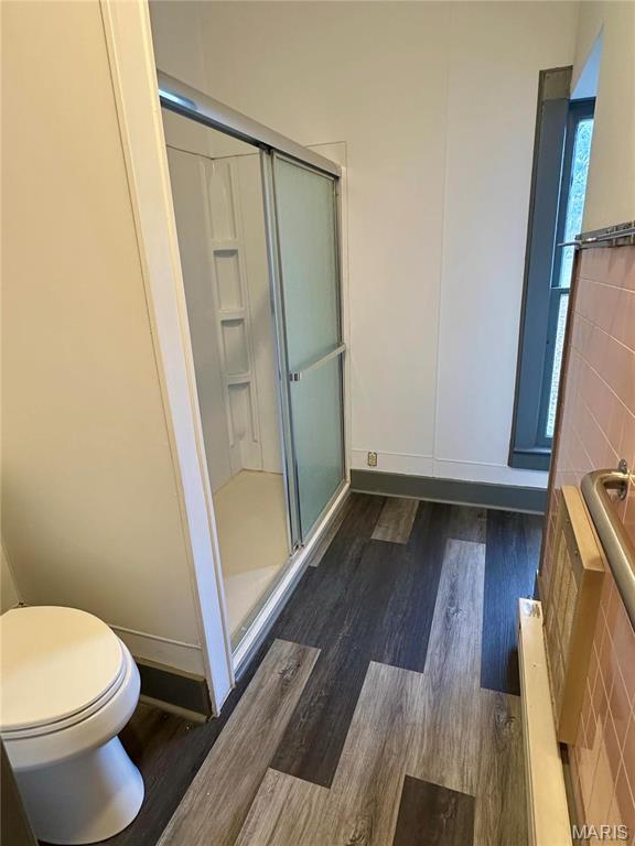 58798 Plevna Pl, Shelbyville, MO 63469 - full bath with wood finished floors and a stall shower