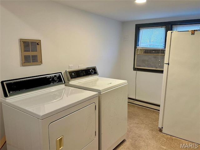 58798 Plevna Pl, Shelbyville, MO 63469 - laundry room with baseboard heating, light colored carpet, separate washer and dryer, and cooling unit