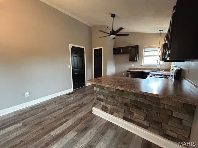 1351 Stone Mill Cir, Arnold, MO 63010 - kitchen featuring appliances with stainless steel finishes, a peninsula, a ceiling fan, dark wood-style floors, and crown molding