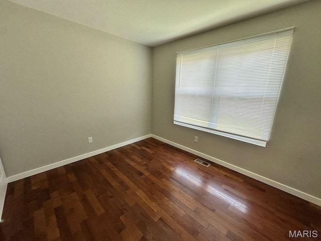 69 Jakes Ct, Ofallon, MO 63366 - unfurnished room with dark wood-type flooring