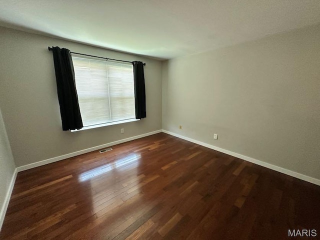 69 Jakes Ct, Ofallon, MO 63366 - unfurnished room with dark wood-style floors and baseboards