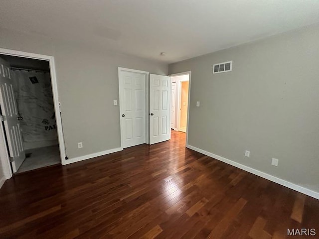 69 Jakes Ct, Ofallon, MO 63366 - unfurnished bedroom featuring baseboards and wood finished floors