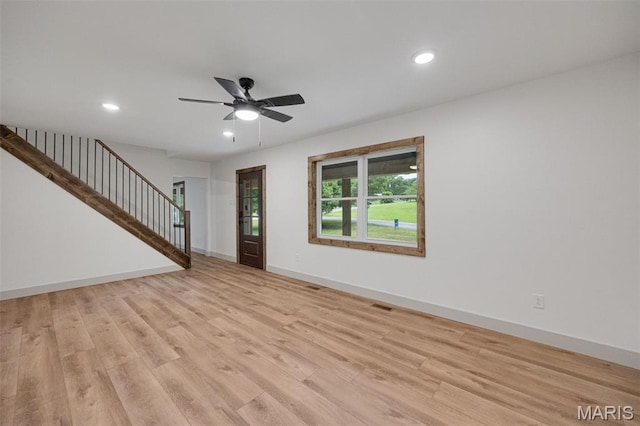 10293 Strange Rd, Potosi, MO 63664 - unfurnished living room featuring stairway, ceiling fan, light wood-type flooring, and recessed lighting