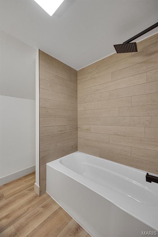 10293 Strange Rd, Potosi, MO 63664 - full bathroom featuring a bath, wood finished floors, and tiled shower
