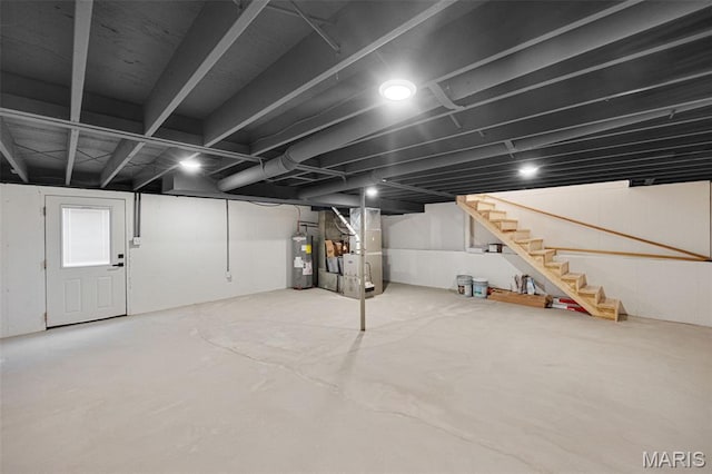 10293 Strange Rd, Potosi, MO 63664 - below grade area featuring water heater, stairway, and heating unit