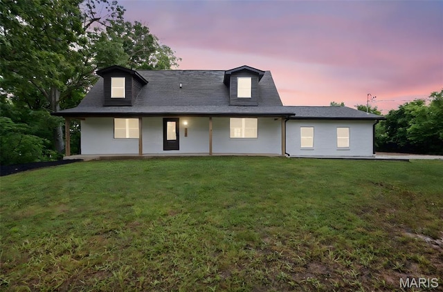 10293 Strange Rd, Potosi, MO 63664 - back of house at dusk featuring a yard and a porch