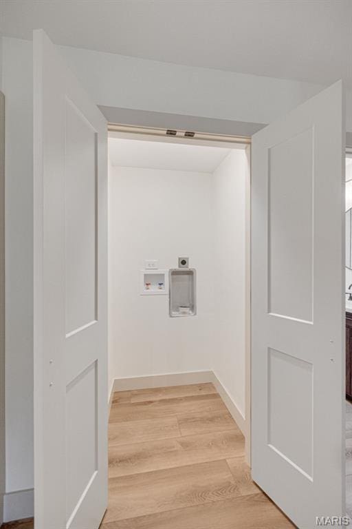 10293 Strange Rd, Potosi, MO 63664 - washroom with hookup for an electric dryer, light wood-style flooring, and hookup for a washing machine