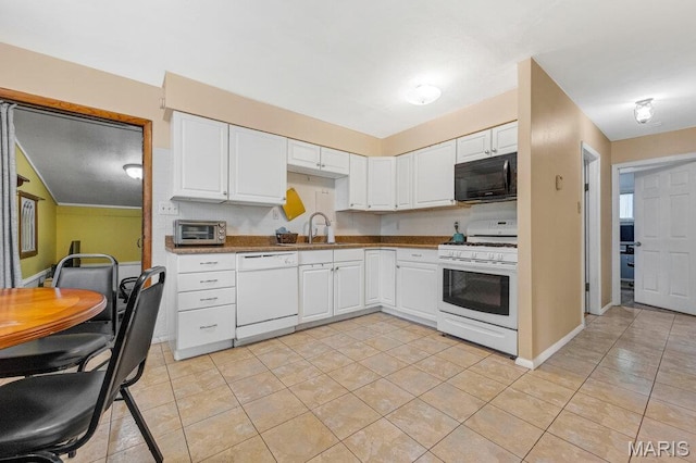 48 Marie Dr, Saint Charles, MO 63301 - kitchen featuring white appliances, white cabinetry, light tile patterned flooring, and dark countertops
