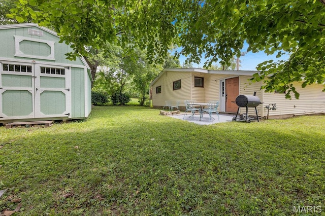 48 Marie Dr, Saint Charles, MO 63301 - view of green lawn with a storage shed and a patio