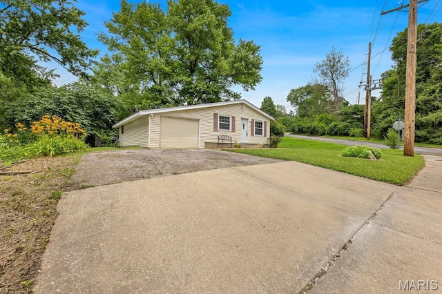 48 Marie Dr, Saint Charles, MO 63301 - view of front of property with a garage, driveway, and a front lawn