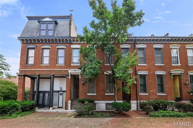 1302 S 10th, Saint Louis, MO 63104 - view of front of property with a high end roof, brick siding, and mansard roof