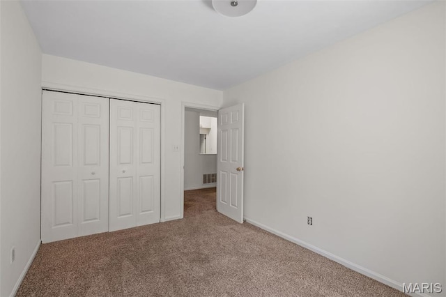1302 S 10th, Saint Louis, MO 63104 - unfurnished bedroom featuring carpet flooring and a closet