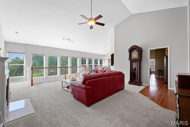 6 Wolverton Ct, Saint Charles, MO 63301 - carpeted living room with ceiling fan, high vaulted ceiling, a chandelier, and wood finished floors
