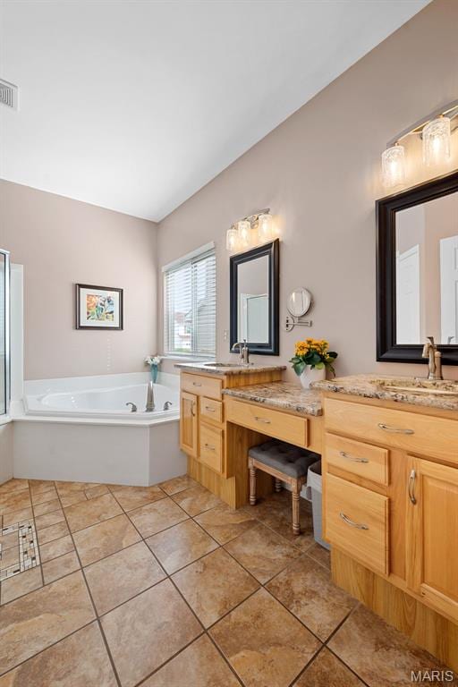6 Wolverton Ct, Saint Charles, MO 63301 - bathroom with tile patterned flooring, a bath, vanity, and vaulted ceiling