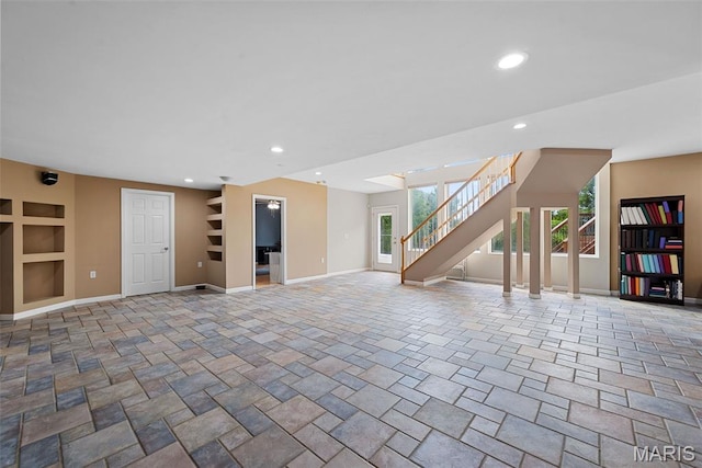 6 Wolverton Ct, Saint Charles, MO 63301 - unfurnished living room with built in features, recessed lighting, and stairs