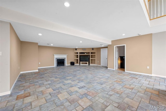 6 Wolverton Ct, Saint Charles, MO 63301 - unfurnished living room with a high end fireplace, stone finish floors, built in features, and recessed lighting