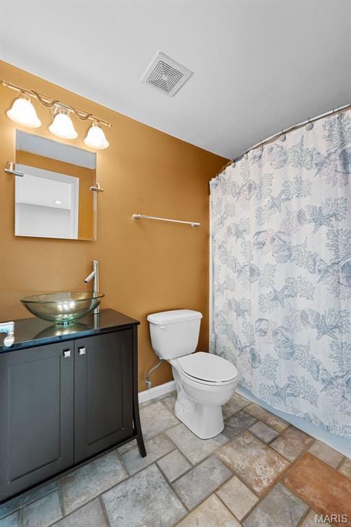 6 Wolverton Ct, Saint Charles, MO 63301 - full bath featuring vanity, stone finish flooring, and a shower with shower curtain