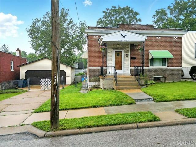 4934 Tiemann Ave, Saint Louis, MO 63123 - view of front of property with brick siding, a gate, and a detached garage