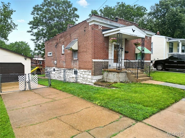 4934 Tiemann Ave, Saint Louis, MO 63123 - shotgun-style home featuring brick siding, a gate, an outdoor structure, and a garage