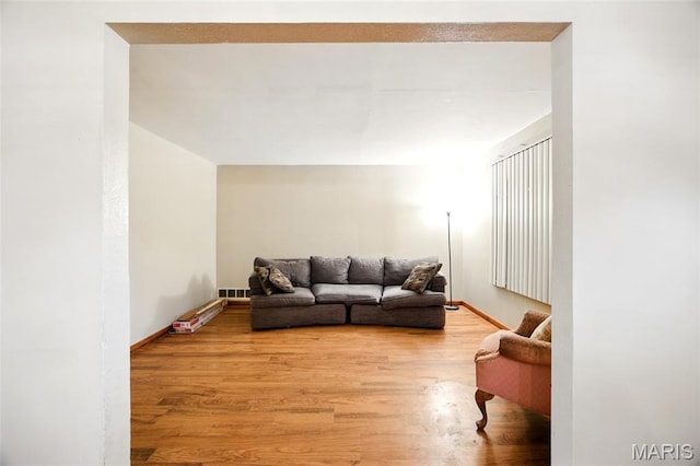4934 Tiemann Ave, Saint Louis, MO 63123 - living area featuring wood finished floors and baseboards