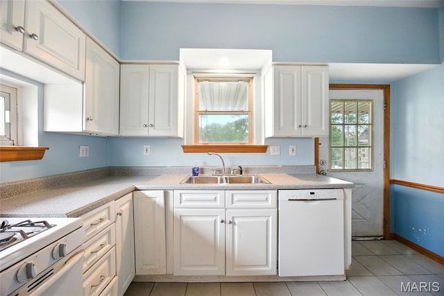4934 Tiemann Ave, Saint Louis, MO 63123 - kitchen featuring white appliances, white cabinetry, light tile patterned floors, and light countertops