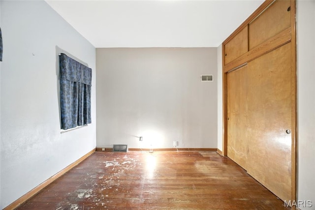 4934 Tiemann Ave, Saint Louis, MO 63123 - unfurnished bedroom with hardwood / wood-style floors and a closet