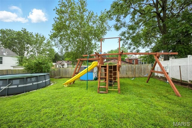 4934 Tiemann Ave, Saint Louis, MO 63123 - view of jungle gym with a fenced backyard