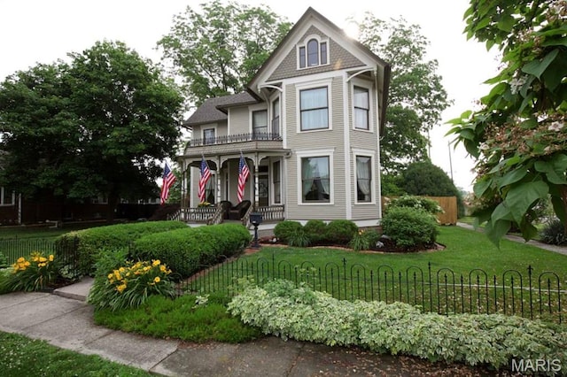 302 N Main St, Saint Elmo, IL 62458 - victorian house featuring a porch and a balcony