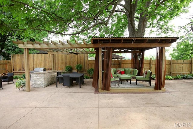 302 N Main St, Saint Elmo, IL 62458 - fenced backyard featuring an outdoor hangout area, a patio area, exterior kitchen, and a pergola