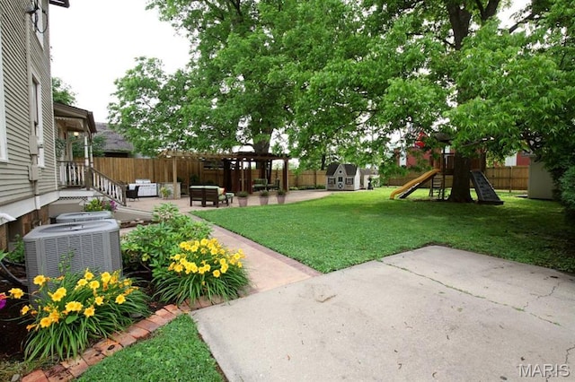 302 N Main St, Saint Elmo, IL 62458 - view of yard with a patio, a playground, and an outbuilding