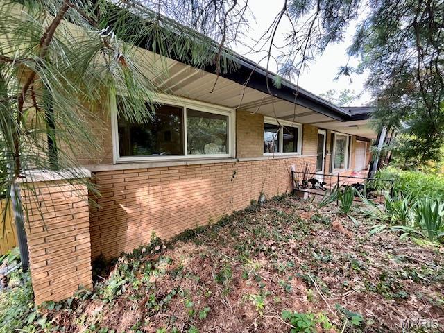 3 Cardigan Ln, Saint Louis, MO 63135 - view of side of home featuring brick siding