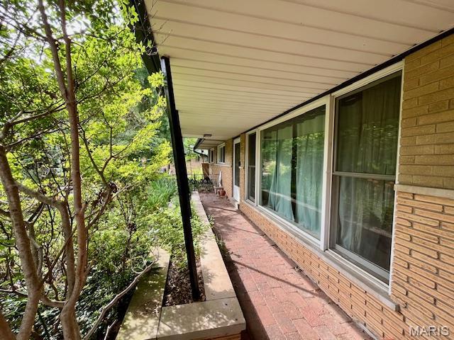 3 Cardigan Ln, Saint Louis, MO 63135 - view of side of property featuring brick siding