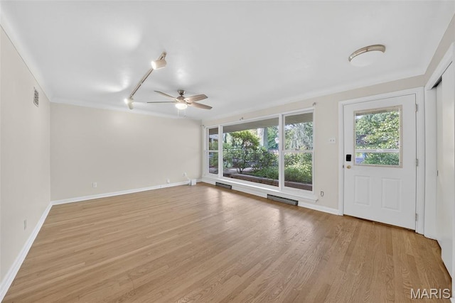 3 Cardigan Ln, Saint Louis, MO 63135 - spare room featuring a ceiling fan, healthy amount of natural light, light wood-type flooring, and crown molding